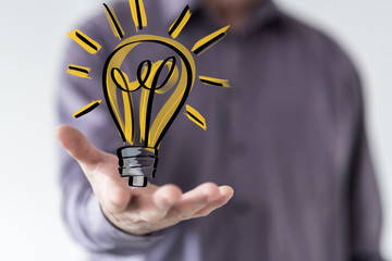  holding illuminated light bulb, idea, innovation and inspiration concept.