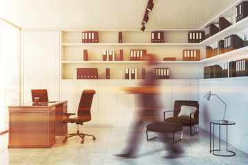 Canvas Print - Businessman walking in white CEO office