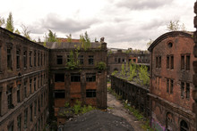 View Of The Old Factory Buildings. Old Brick Building In Loft Style.