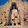 Afghanistan, Bamian Valley. A person stands at the base of the Great Buddha in the Bamian Valley, a World Heritage Site, in Afghanistan.