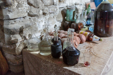 Canvas Print - Georgia, Kakheti. Traditionally made wine in glass bottles.