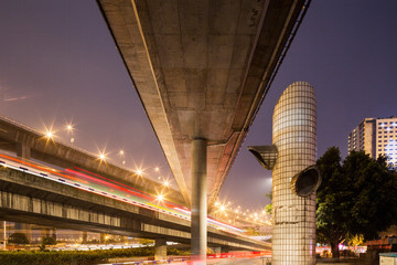 China, Chongqing, Overhead expressways on approach to bridge spanning Yangtze River on autumn evening