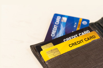 Bank credit cards arrange in wallet, leather pocket wallet contain credit cards.