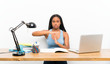 © luismolinero - African American teenager student girl with long braided hair in her workplace making time out gesture