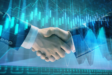 Multi exposure of forex graph on abstract background with two businessmen handshake. Concept of success on stock market