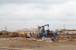 © Alida Latham/Danita Delimont - Azerbaijan, Baku. A pumpjack at the edge of a residential area outside of Baku.