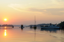 Canada, British Columbia, Gulf Islands, Wallace Island. Yellow Sunset With Anchored Boats In Princess Bay