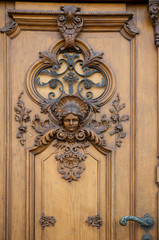 Sticker - Austria, Vienna. Exterior view of a door with ornate carving.