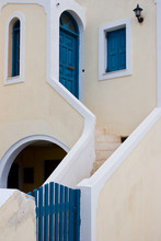 Greece, Santorini, Thira, Oia. Staircase Leading From Blue Gate To Blue Door And Window Shutters.