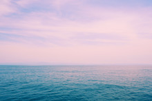 Beautiful Blue Sea And Pink Sky Sunset Background.