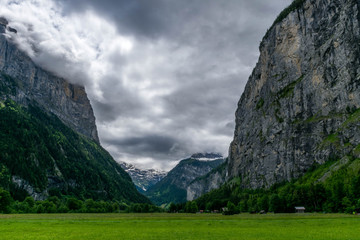 Wall Mural - Stormy alpine valley near Lauterbrunnen village, Switzerland