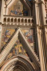 Wall Mural - Italy, Umbria, Orvieto. The Cathedral of Orvieto or Duomo of Orvieto. 13th century Gothic masterpiece, one of the best Gothic buildings in Italy. Detail of facade with religious mosaic..