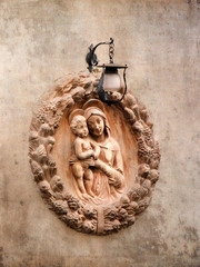 Canvas Print - Italy, Tuscany. Terra cotta adornment on a wall in the town of Impruneta.