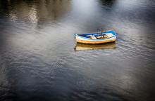 Portugal, Tavira, Lone Boat At Anchor In Bay
