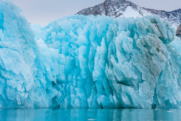 Sticker - Greenland. East Greenland. Liverpool Land. Warming Island. Blue iceberg showing melting pattern.