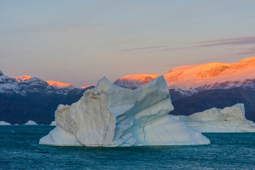 Poster - Greenland. Scoresby Sund. Gasefjord. Sunrise on the mountains with icebergs.