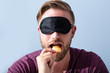 Blindfolded Man Testing Food
