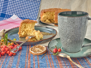 Wall Mural - Cup of black tea.And Apple sponge cake.