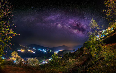 Wall Mural - milky way galaxy in the darkest night with beautiful mountain shape in mon jam, chiang mai, thailand