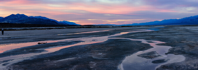 Wall Mural - Water on salt flats at sunset. Death Valley. California.