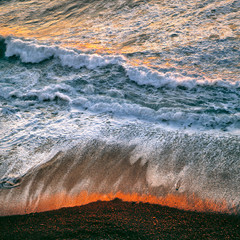 Wall Mural - USA, California, Big Sur. Breaking surf catches the late fiery light of sunset at Big Sur on the California coast.