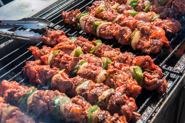 Wall Mural - USA, Florida, Mount Dora, shish kebab grilling at art festival.