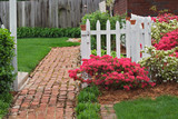 Brick sidewalk, picket fence, and azaleas, Audubon Park neighborhood, Louisville, Kentucky