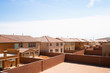Las Vegas, NV, USA - High angle view of the backyards of a residential community in a desert area.