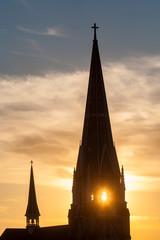 Sticker - Church steeple against a sunset sky, west Grand Rapids, Michigan, USA.