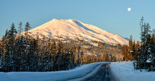 Deschutes National Forest, Oregon, USA. Mt. Bachelor And Moon From Cascade Lakes Highway In Winter.