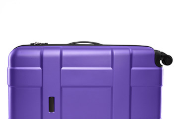 Wall Mural - Fragment of purple plastic valise on wheels isolated on white background