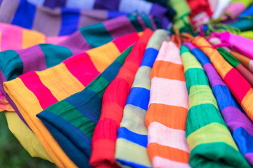 Stack of colourful silk scarfs