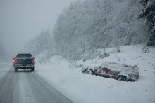 NA, USA, Washington State, Olympic Peninsula, Hwy 104, Cars In Blizzard Conditions Passing A Wrecked Car 