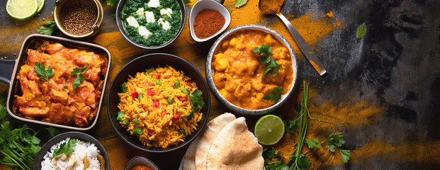 assorted indian food on black background..