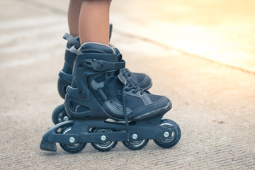 Closeup inline rollerblade on the legs