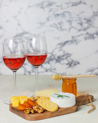 Wall Mural - cheese plate,camembert cheese ,rosemary ,crackers,dry apricot and walnuts