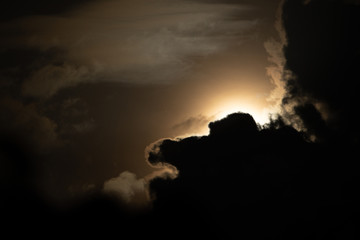 Wall Mural - Moon light behind cloud
