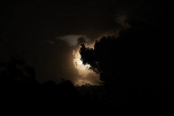 Wall Mural - Moon light behind cloud