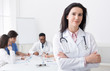 © Prostock-studio - Female doctor looking at camera during meeting