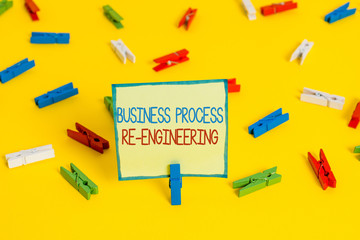 Text sign showing Business Process Re Engineering. Business photo text the analysis and design of workflows Colored clothespin papers empty reminder yellow floor background office