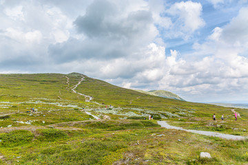 Wall Mural - people walking on the trails on a mountain plateau