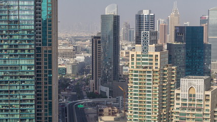  Aerial top view of Dubai Marina morning timelapse. Modern towers and traffic on the road