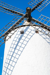 old windmill on blue sky background