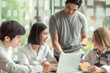 © amnaj - Group of young business people brainstorming at a meeting starting a new business.