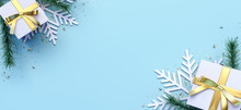Blue Christmas Background Decorated With Two White Gifts And Snowflakes 3D Rendering