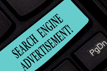 Text sign showing Search Engine Advertisement. Conceptual photo Placing online advertisements on webpages Keyboard key Intention to create computer message pressing keypad idea