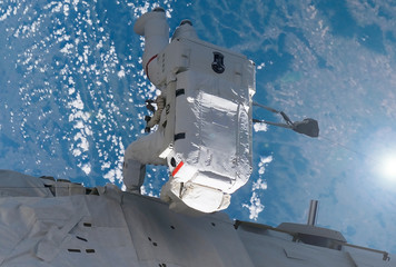 Wall Mural - astronaut from the back, at the space station. elements of this image were furnished by nasa