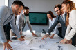 © NDABCREATIVITY - Group of architects and business people working together and brainstorming