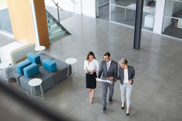 Wall Mural - Group of business people.Business people sharing their new ideas.