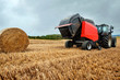 © Image'in - farmer in fields making straw bales